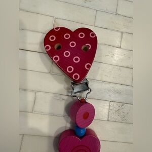 NWOT - Haba wooden hearts chain pacifier holder

Brand new without packaging.